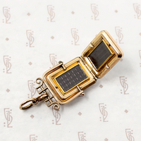 It spins in an ornate gold filled frame, perfect for fidgeting with. 