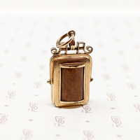 It spins in an ornate gold filled frame, perfect for fidgeting with. 