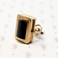 It spins in an ornate gold filled frame, perfect for fidgeting with. 
