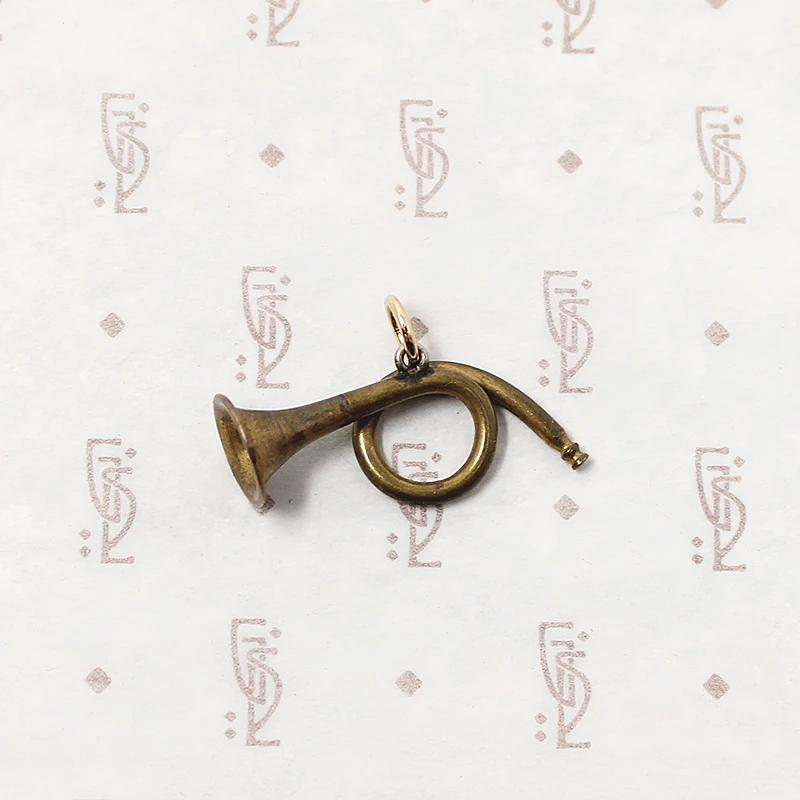 adorable little brass horn charm