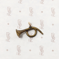 adorable little brass horn charm