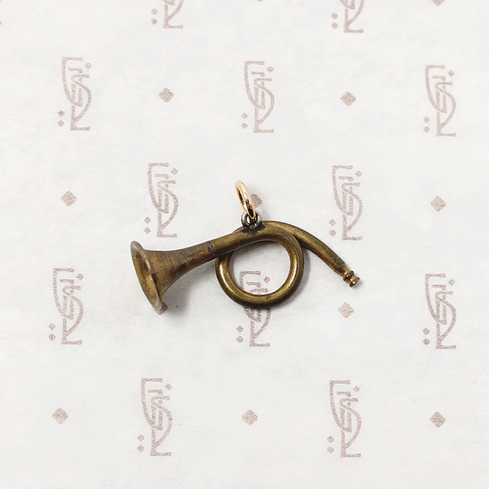 adorable little brass horn charm