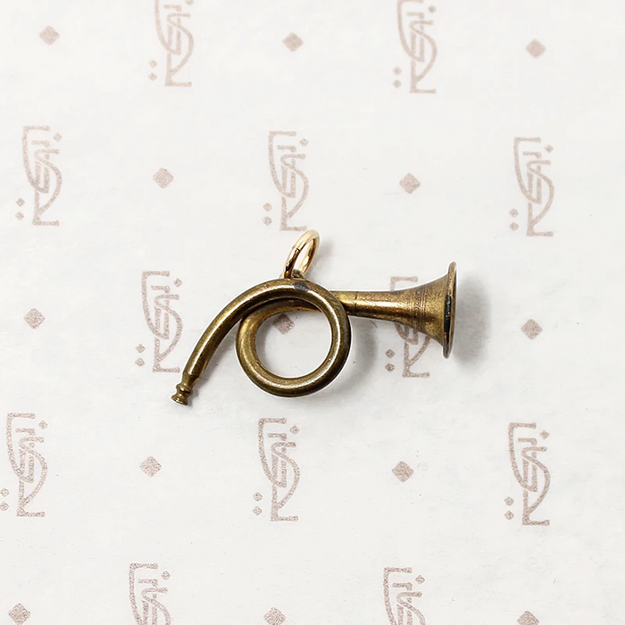 adorable little brass horn charm