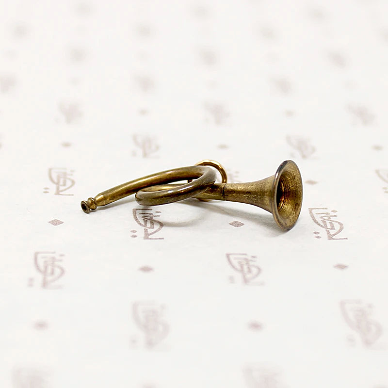 adorable little brass horn charm