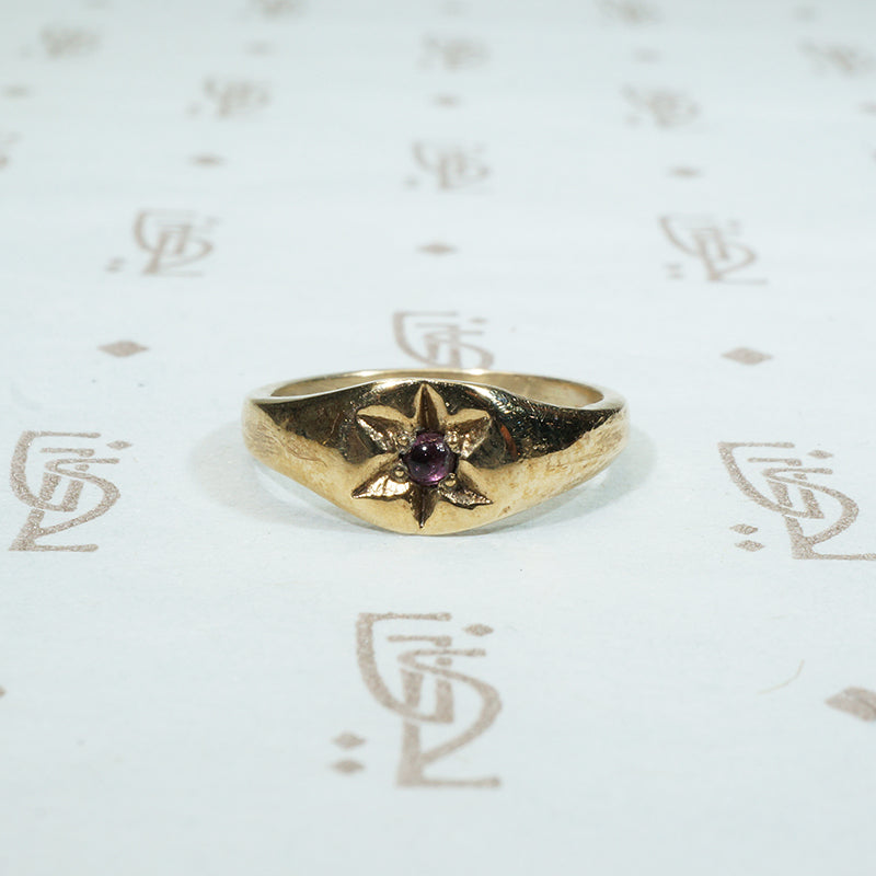 10k yellow gold tiny ring with a star set amethyst