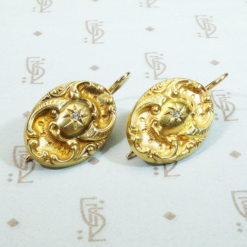 repoussé 14k gold mine cut diamond star earrings