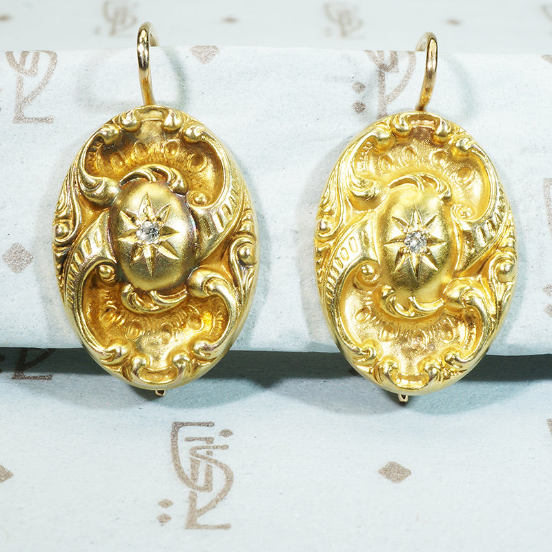 repoussé 14k gold mine cut diamond star earrings