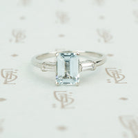 emerald cut aquamarine with baguette diamond sides in platinum