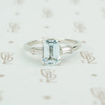 emerald cut aquamarine with baguette diamond sides in platinum