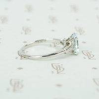 emerald cut aquamarine with baguette diamond sides in platinum side view