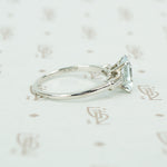 emerald cut aquamarine with baguette diamond sides in platinum side view