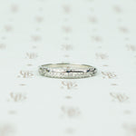 channel set diamond white gold band with arrow design