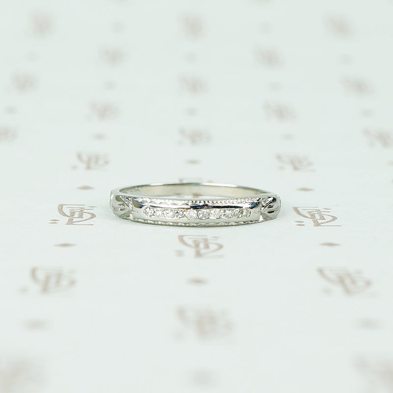 channel set diamond white gold band with arrow design