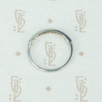 channel set diamond white gold band with arrow design side view
