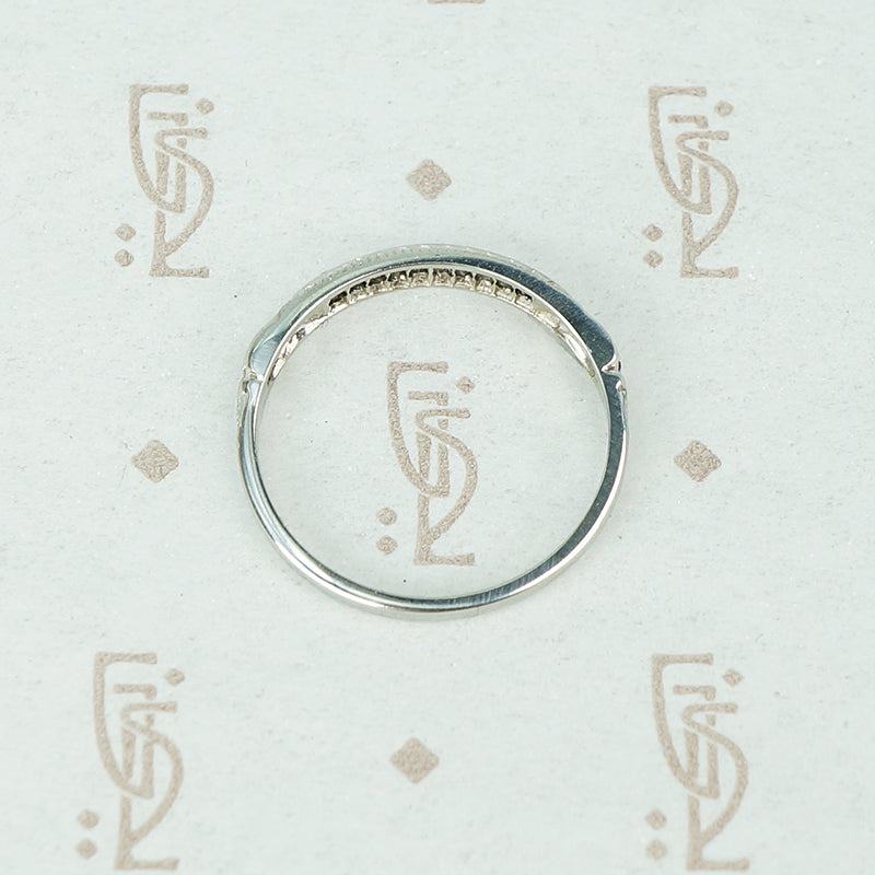 channel set diamond white gold band with arrow design side view
