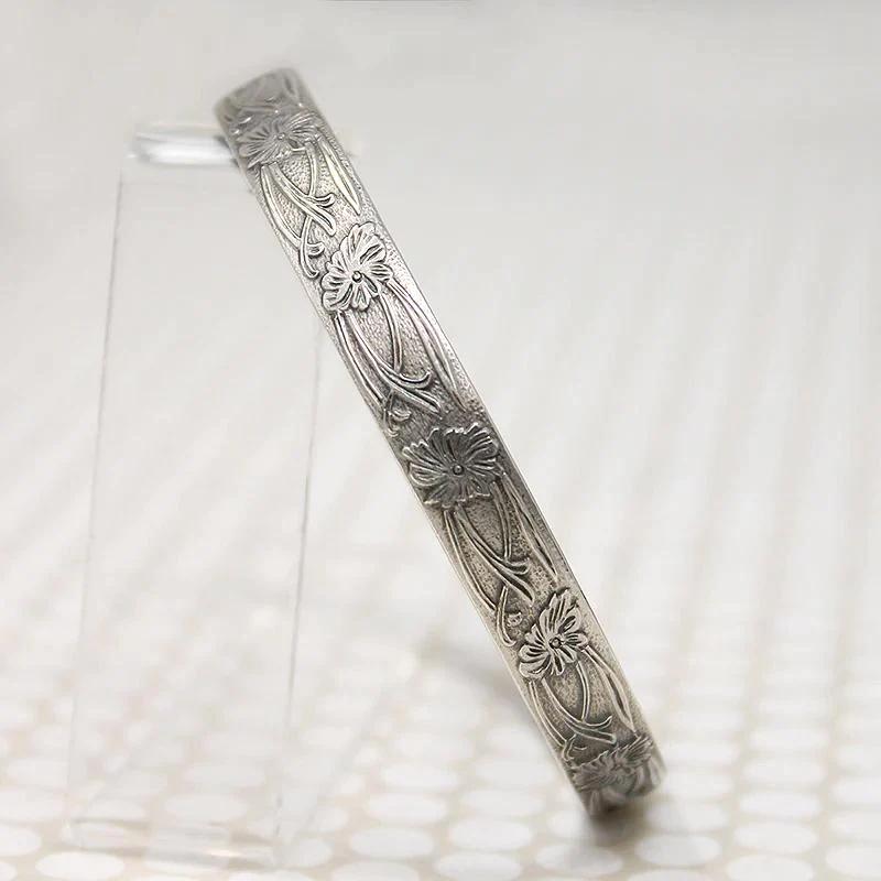 The Art Nouveau Patterned Sterling Bangle from Allie B.