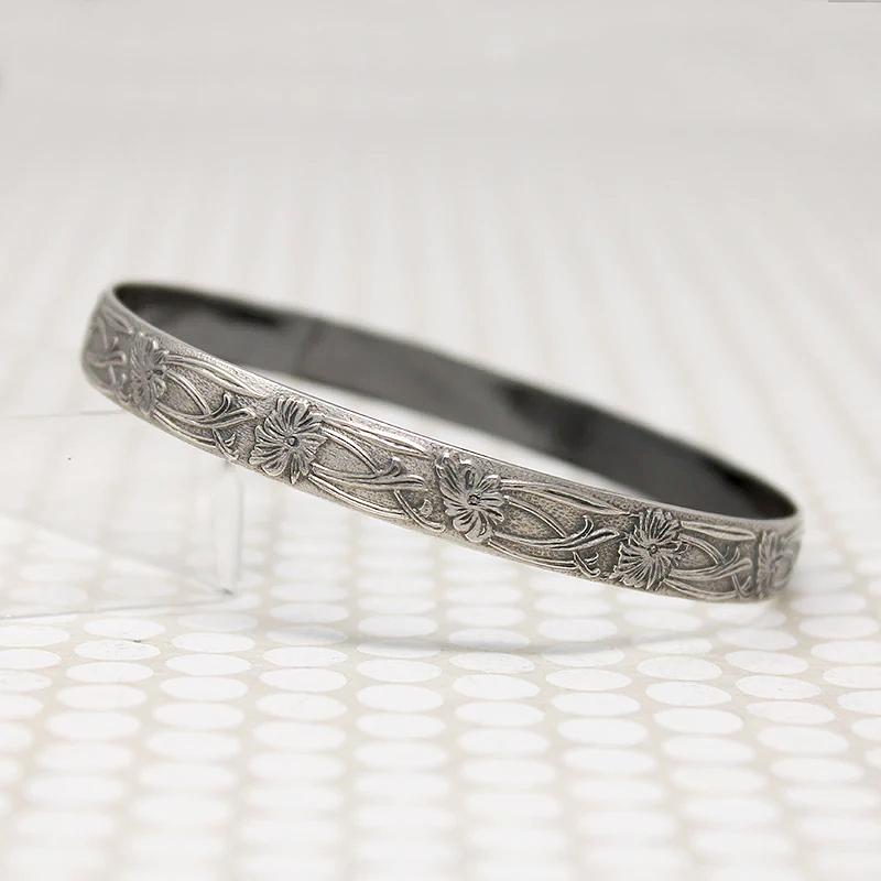The Art Nouveau Patterned Sterling Bangle from Allie B.