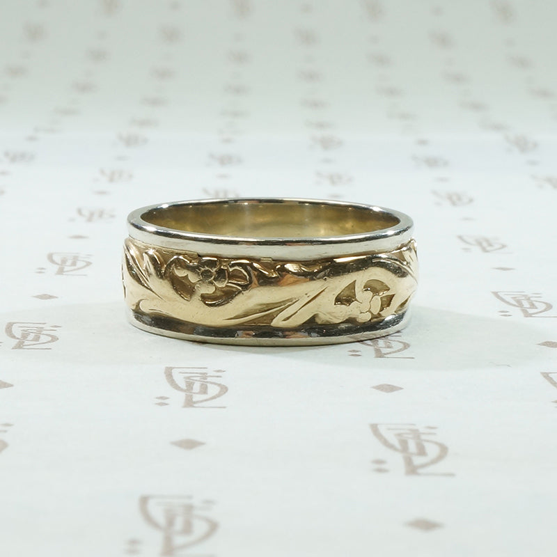 art carved 2 tone vintage wedding band with lightly worn flowers
