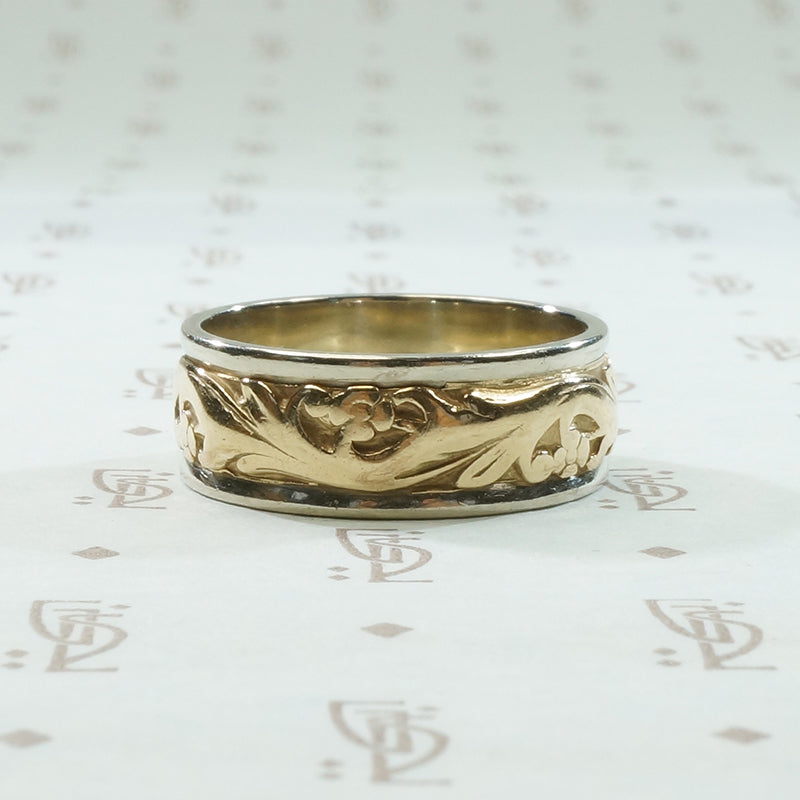 art carved 2 tone vintage wedding band with lightly worn flowers