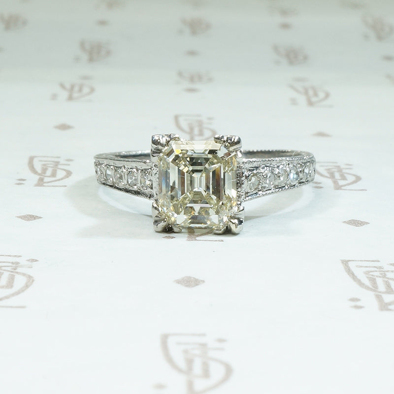 1.46 carat emerald step cut antique diamond engagement ring in platinum