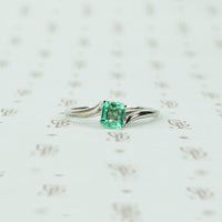 mid century platinum and emerald engagement ring