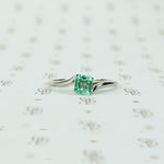 mid century platinum and emerald engagement ring