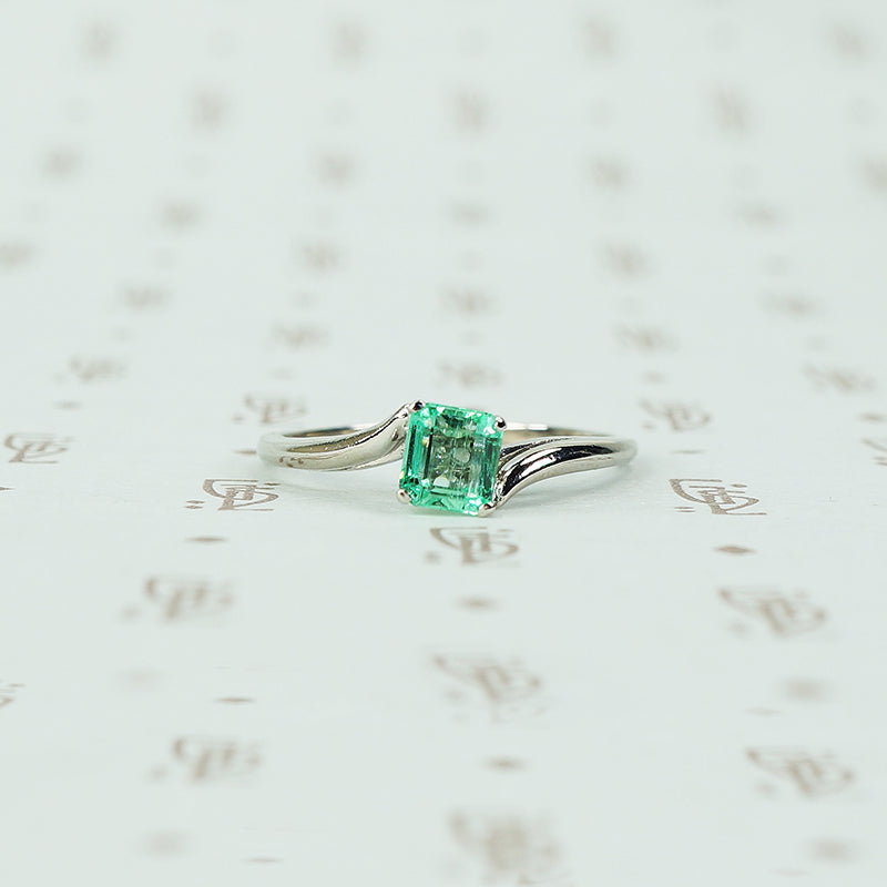 mid century platinum and emerald engagement ring