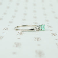 mid century platinum and emerald engagement ring side view
