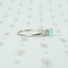 mid century platinum and emerald engagement ring side view