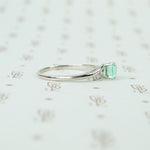 mid century platinum and emerald engagement ring side view