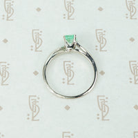 mid century platinum and emerald engagement ring side view
