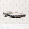 set of four slim sterling silver bangles