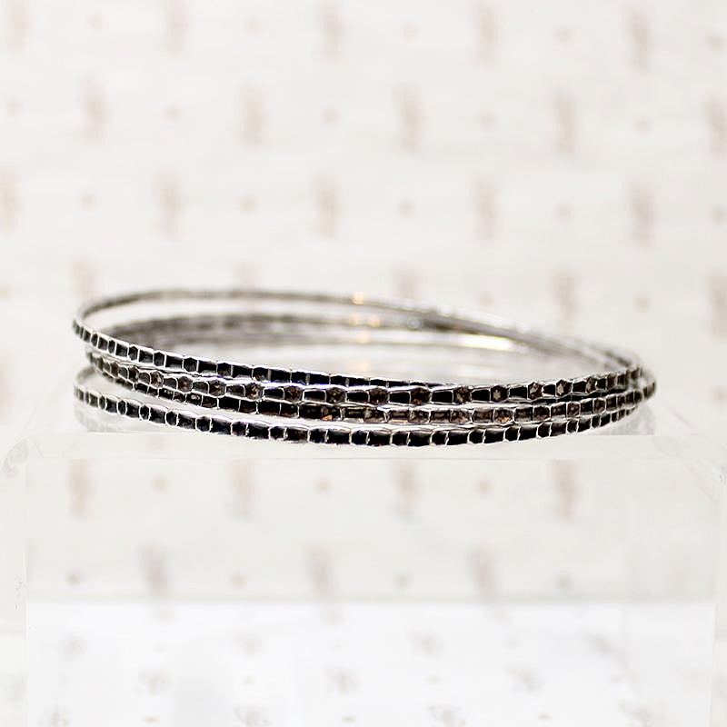 set of four slim sterling silver bangles