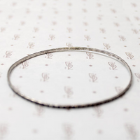 set of four slim sterling silver bangles
