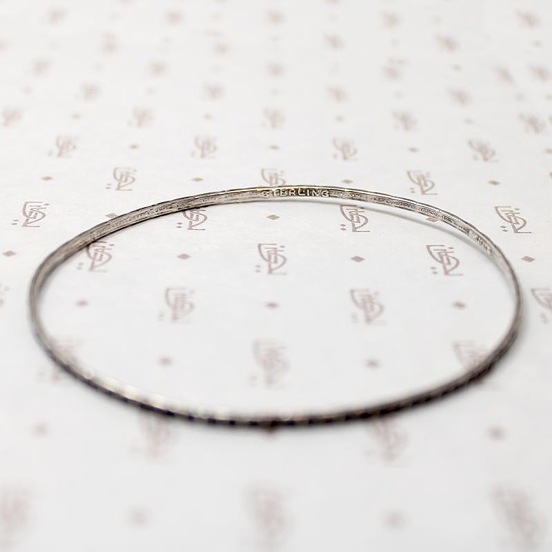 set of four slim sterling silver bangles