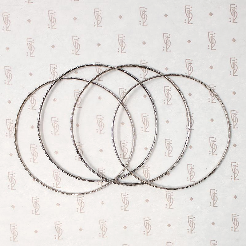 set of four slim sterling silver bangles