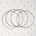 set of four slim sterling silver bangles