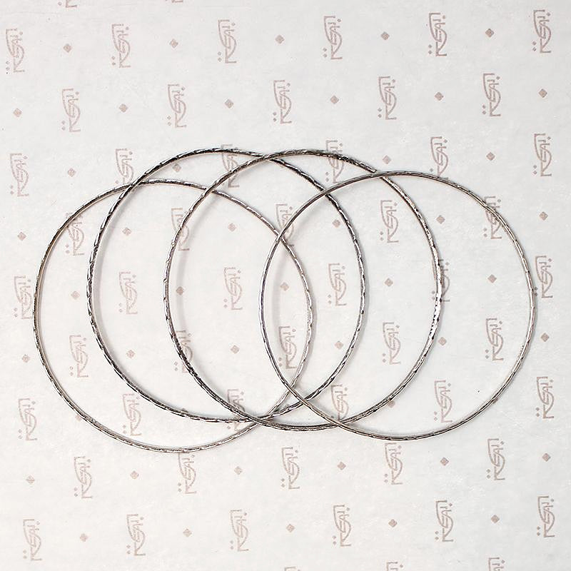 set of four slim sterling silver bangles