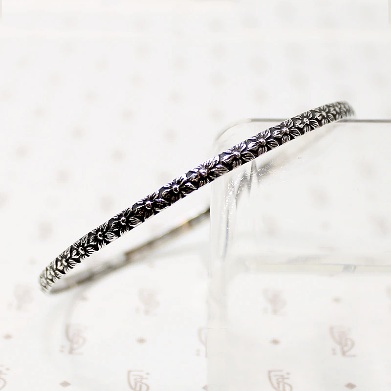 Crisply Engraved Flower Bangle Signed "Sterl-Hedy"