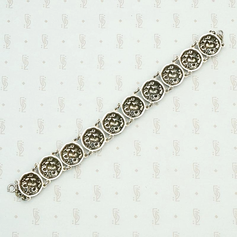 Cheerful Sterling Repoussé Daisy Bracelet, back view.