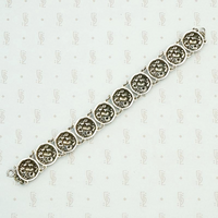 Cheerful Sterling Repoussé Daisy Bracelet, back view.