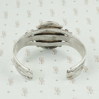 back view american silver cuff with arrow pattern and big turquoise
