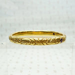American Art Nouveau 14k Repoussé Bangle Bracelet set with Amethysts. Side view.