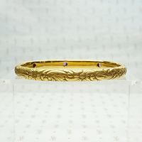 American Art Nouveau 14k Repoussé Bangle Bracelet set with Amethysts. Back view.
