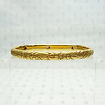 American Art Nouveau 14k Repoussé Bangle Bracelet set with Amethysts. Back view.
