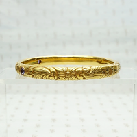 American Art Nouveau 14k Repoussé Bangle Bracelet set with Amethysts. Side view.
