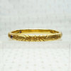 American Art Nouveau 14k Repoussé Bangle Bracelet set with Amethysts. Side view.