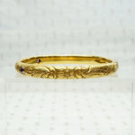 American Art Nouveau 14k Repoussé Bangle Bracelet set with Amethysts. Side view.
