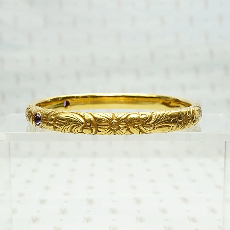 American Art Nouveau 14k Repoussé Bangle Bracelet set with Amethysts. Side view.