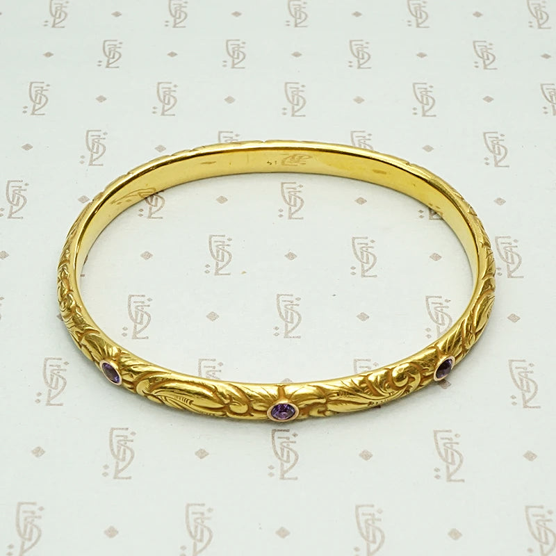 American Art Nouveau 14k Repoussé Bangle Bracelet set with Amethysts. Top view.
